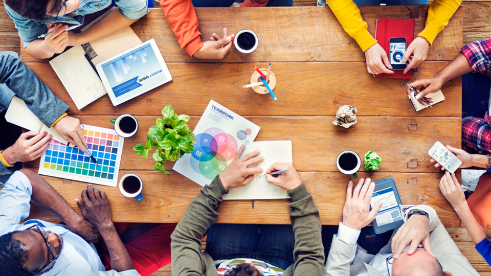 above view of art director meeting with creative team