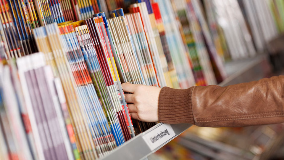 freelancer studying a personal essay in magazine