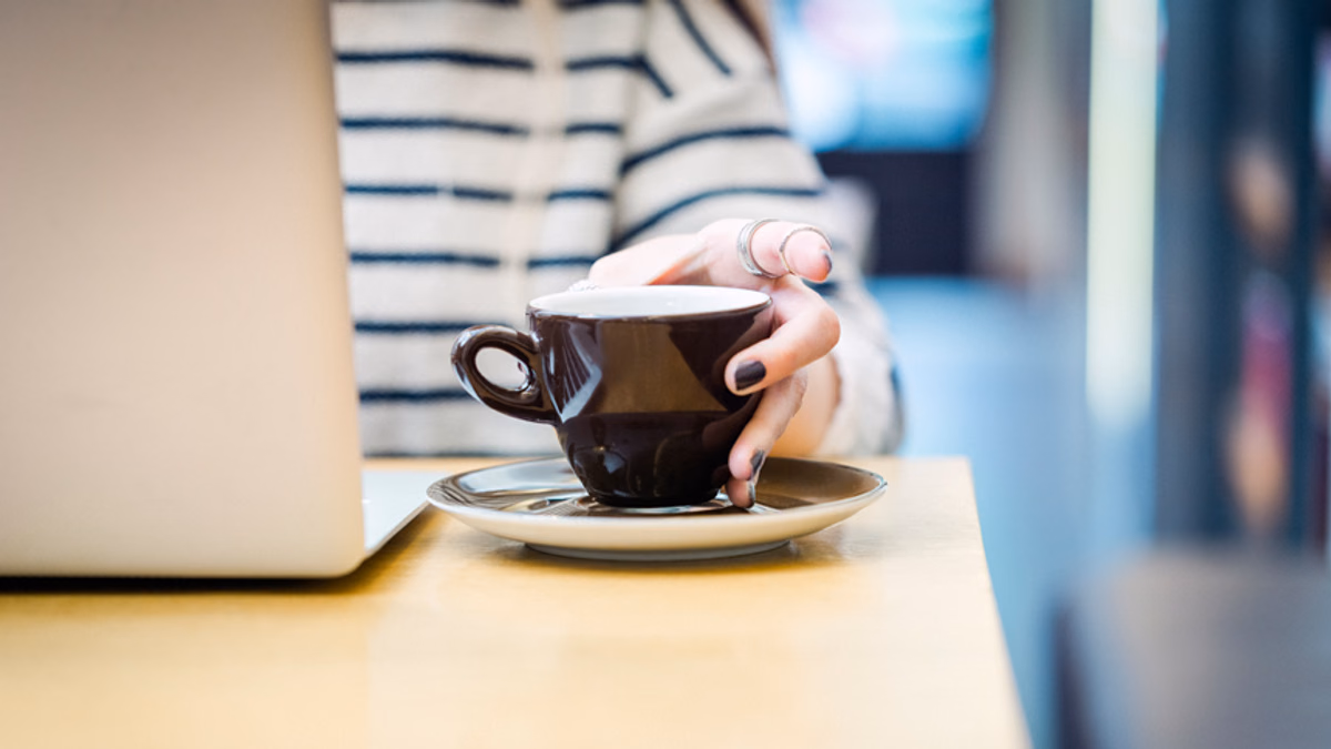 job-seeker at coffee shop on weekend searching for jobs