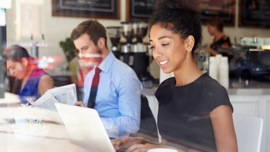 woman at coffee shop reading a job description