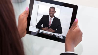 Young man taking a video interview