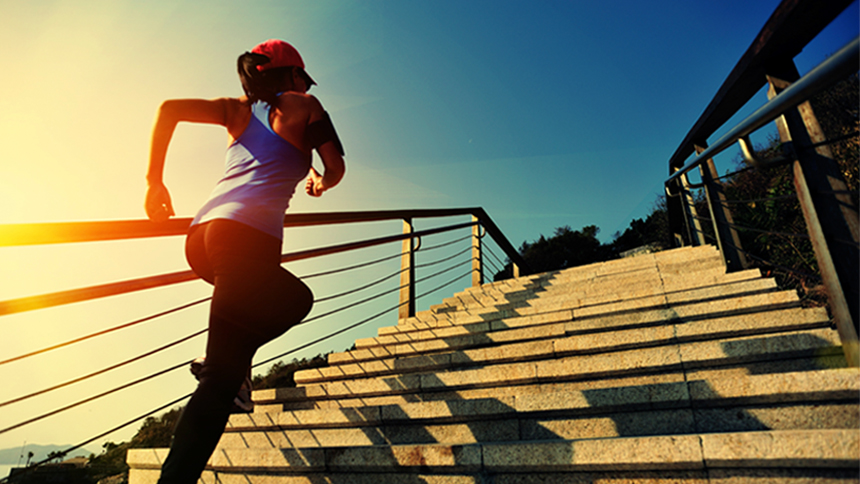 woman running up stairs