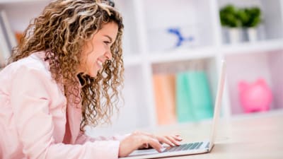 job-seeker using a laptop and social media with her job search