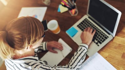 media professional working on computer