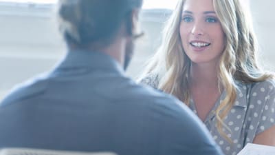 woman asking questions to interviewer