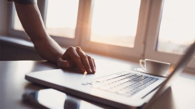 job seeker using laptop on weekend