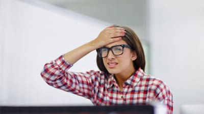 Frustrated woman at her desk