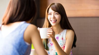 Girls meeting in a coffee shop