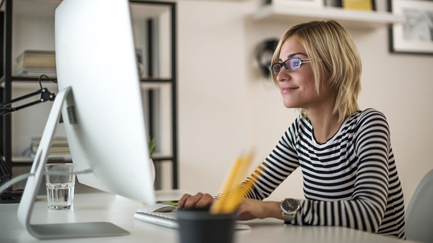 creative woman looking at computer screen