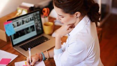 woman writing laptop skills in 60: multimedia copyediting
