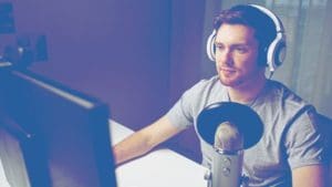 man desk microphone podcasting