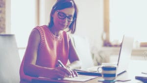 woman writing desk