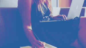 woman writing laptop