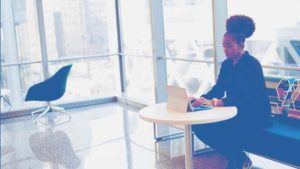 woman working at desk on laptop